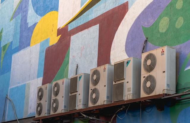 wall air conditioners mounted onto colourful wall